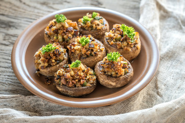 Mushrooms' caps stuffed with mixture of cheese, onion, breadcrum