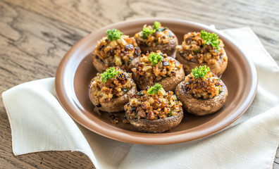 Mushrooms' caps stuffed with mixture of cheese, onion, breadcrum