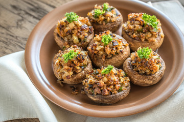 Mushrooms' caps stuffed with mixture of cheese, onion, breadcrum