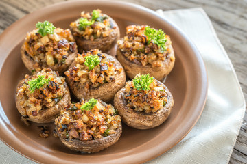 Mushrooms' caps stuffed with mixture of cheese, onion, breadcrum