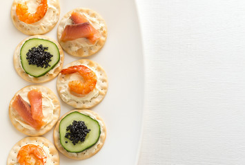 Canape with seafood on the plate