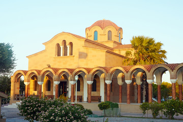cloister and facade of the Orthodox church in Faliraki on Rhodes island.