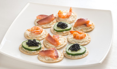 Canape with seafood on the plate