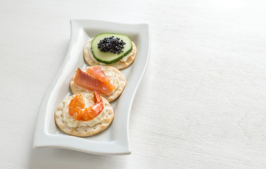 Canape with seafood on the plate