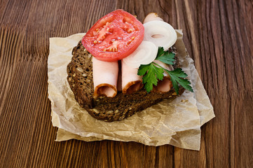 Sandwich with a ham and tomato