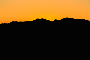 Mountain And Sunset at Mijas, Spain. Dark Silhouette of Mountain
