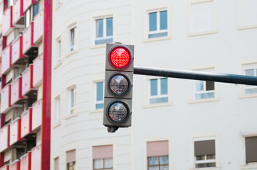 Fototapeta na wymiar Red trafficlight in the city
