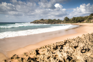 Very rustic and empty beach at the Indian Ocean in the coastal town Praia do Tofo in Inhambane,...