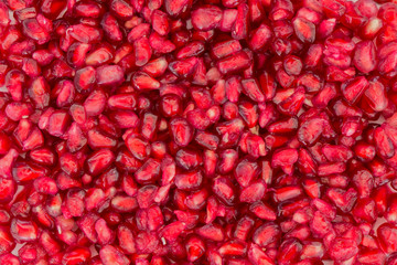 A lot of fresh pomegranate seeds, viewed from above