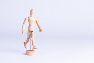 wooden mannekin on white background