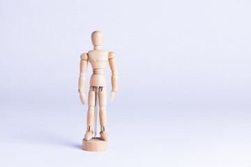 wooden mannekin on white background