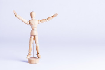 wooden mannekin on white background
