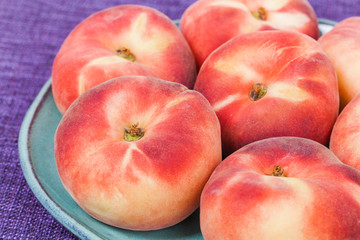 Vineyards Peaches on Plate and Violet Tablecloth