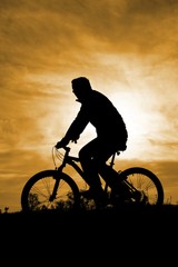 Obraz premium Sunset Biker Silhouette