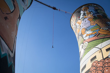 Guy bungee jumping from the Orlando Towers in Soweto, a township of Johannesburg in South Africa. 
