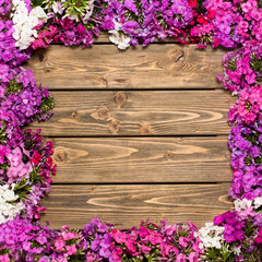 Lilac flowers on wooden background