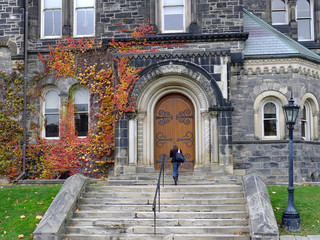 Gothic style college building with colorful fall ivy