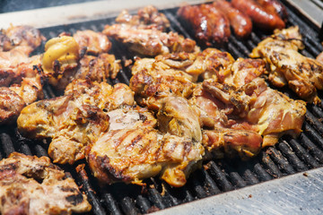 Chicken and sausages on grill selling in the local market