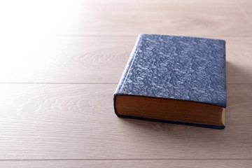 Old book on wooden background