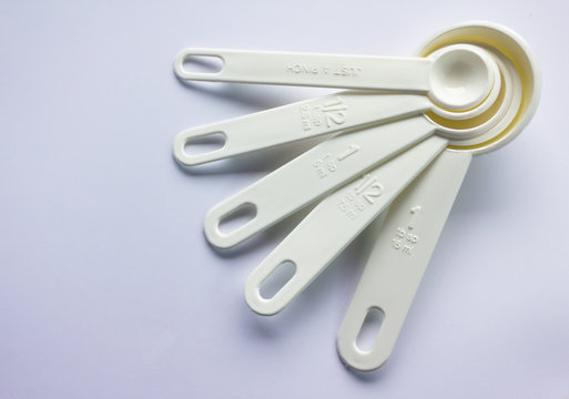 isolate measuring spoon on background