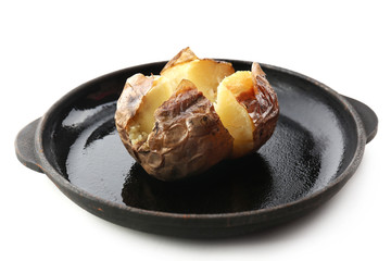 Baked potato on pan isolated on white