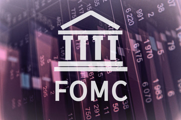 Building icon with inscription FOMC. Financial data on computer screen. Multiple exposure.
