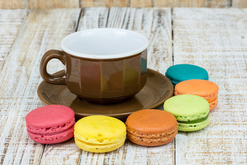 Colorful macarons on vintage pastel background. Macaron is sweet