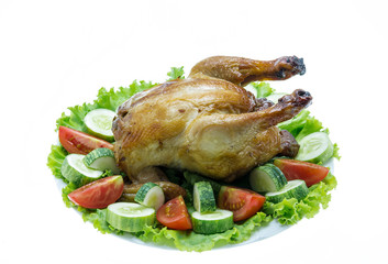 roast chicken with vegetables on a plate on white background