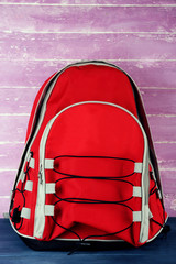 School backpack on wooden background