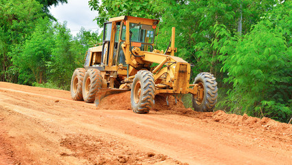 large grader  a narrow rural road
