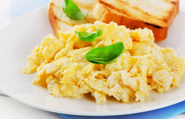 Scrambled eggs with fresh basil.