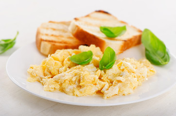 Healthy Breakfast with scrambled eggs and toasts.