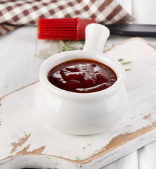 BBQ sauce in a white bowl