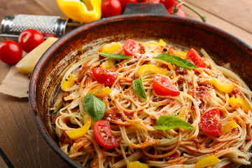 Homemade Spaghetti Bolognese on pan, on wooden background
