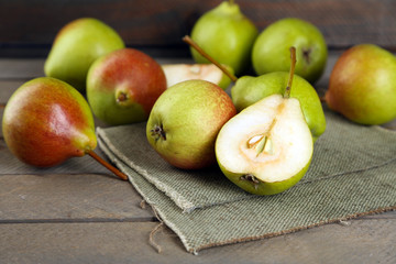 Ripe tasty pears on table close up