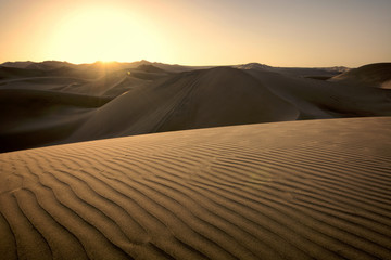 Fototapeta na wymiar Sunset over the dunes, Huacachina, Ica, Peru
