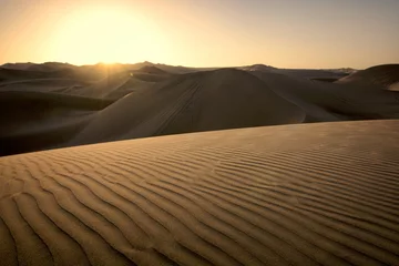 Poster Sunset over the dunes, Huacachina, Ica, Peru © alexpermyakov
