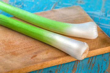 Fresh green leek on kitchen table