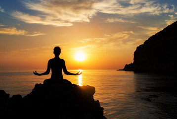 serenity and yoga practicing at sunset, meditation