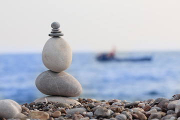 pile of balanced round stones on the beach