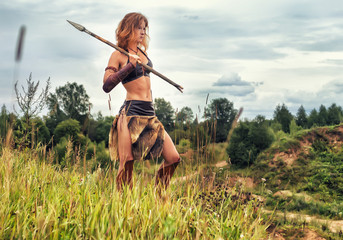 Girl warrior in the field. Amazon on patrol