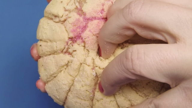 Pulling Pink Sweet bun bread apart Slow Motion 120fps.
