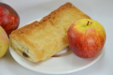 apple pie and fresh apple on dish