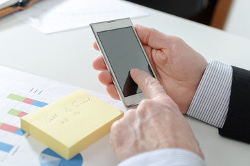 Businessman using his smartphone