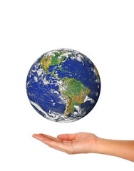 woman's hand holding the earth