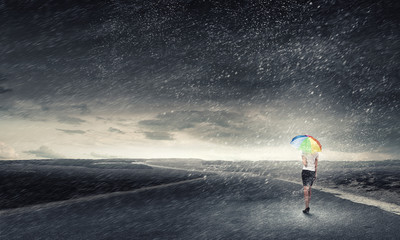 Woman with rainbow umbrella