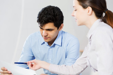 Two young people working as partners