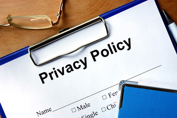Privacy policy form on a wooden table.