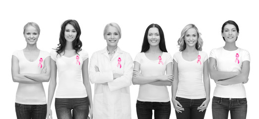 smiling women with pink cancer awareness ribbons