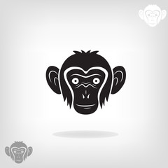 Stylized head of a monkey. 